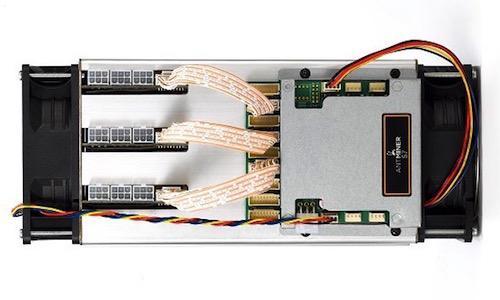 A technician meticulously repairs an ASIC miner, highlighting the complexity and skill involved in the process.